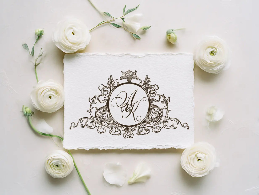 Custom vintage wedding monogram featuring classic intertwined initials and decorative scrollwork, timeless black and white crest design for elegant wedding invitations and heirloom stationery.